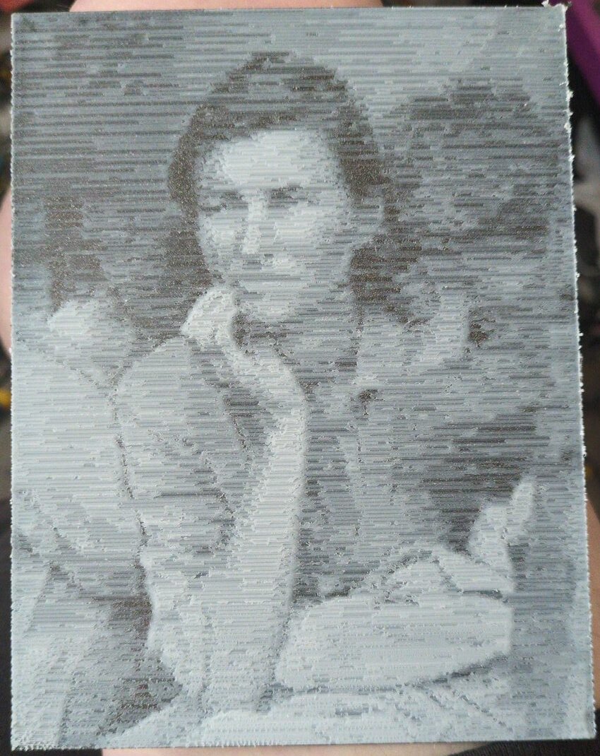 Migrant Mother printed in horizontal white lines on black